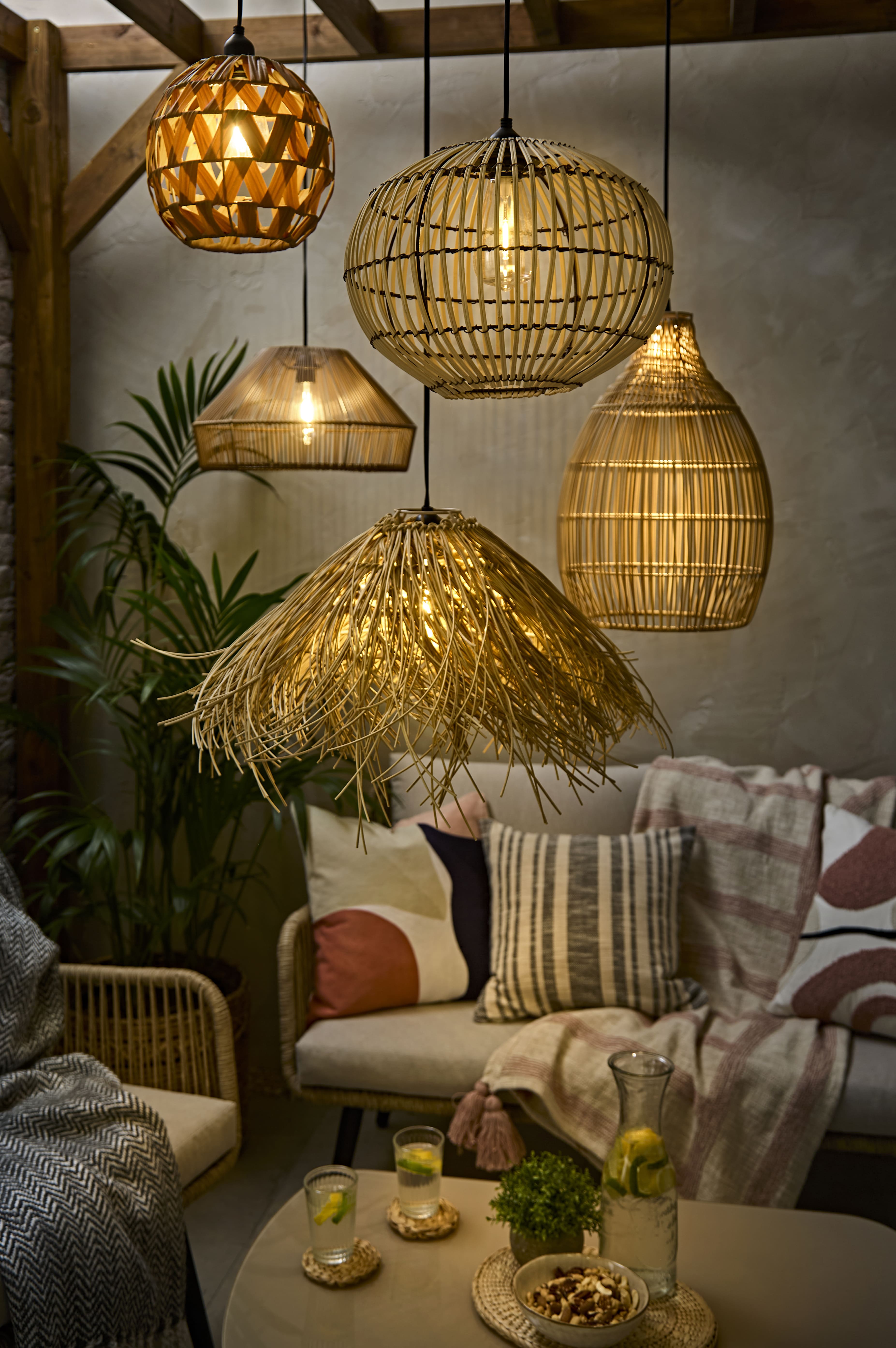 Rattan outdoor pendant lighting, night-time and glowing